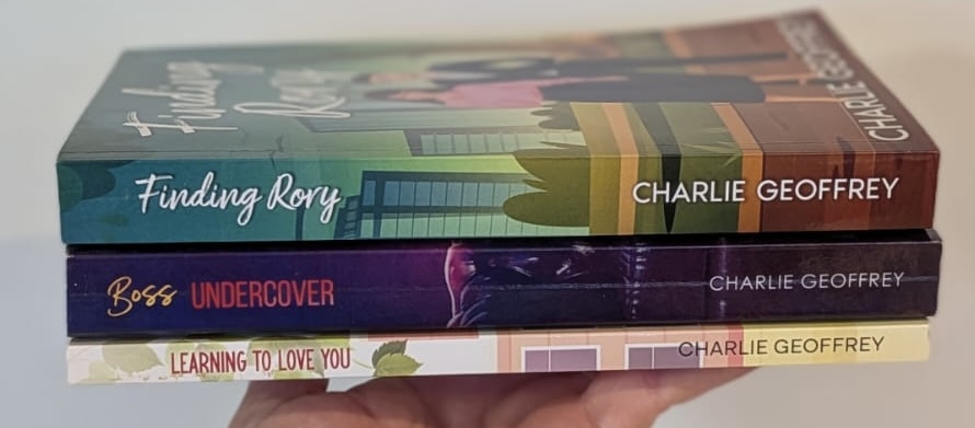 A stack of books written by Charlie Geoffrey